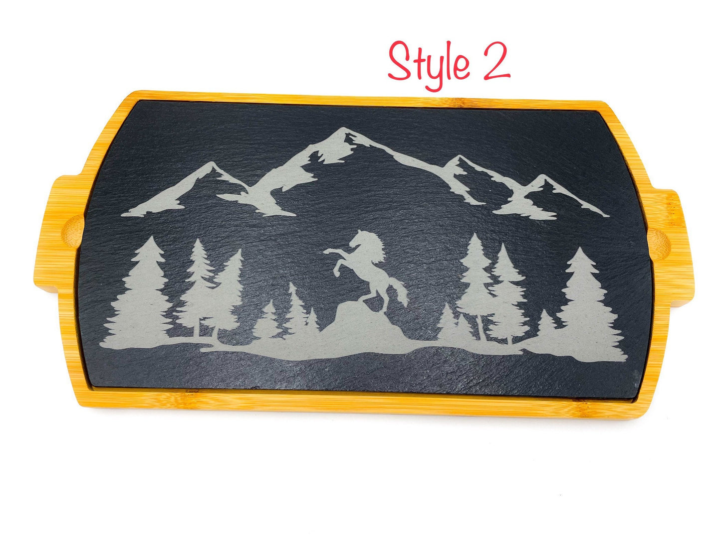 Engraved slate charcuterie board with horse, mountains, and trees. Bamboo on the outside edges. Slate serving tray
