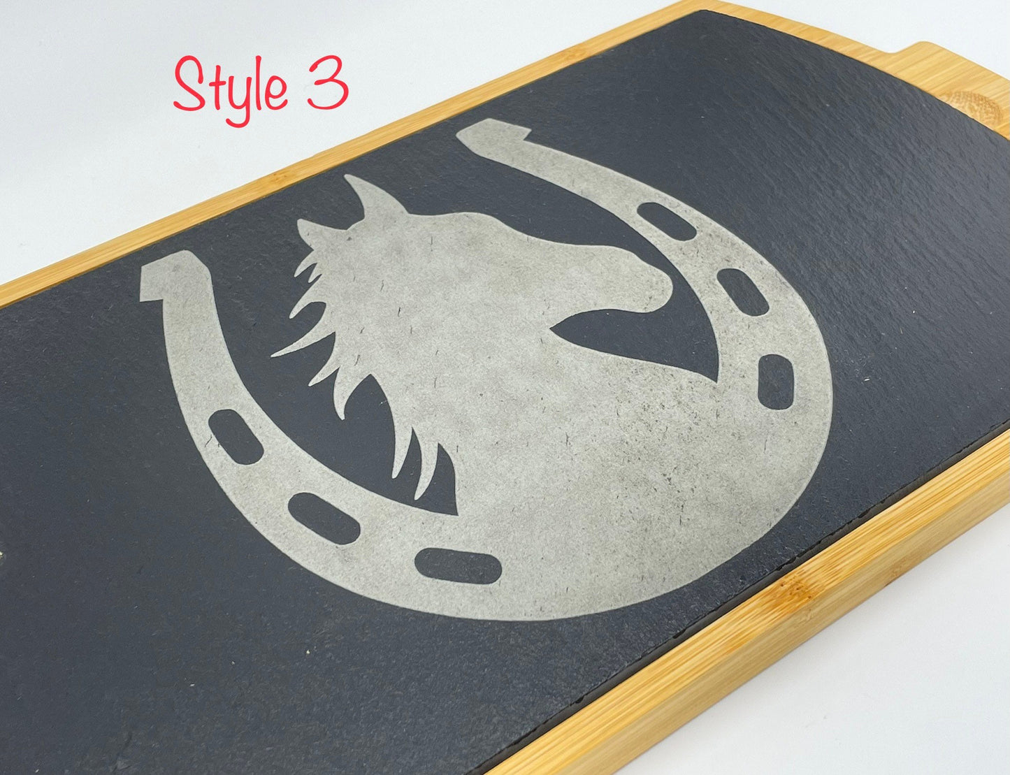 Engraved slate charcuterie board with horse and horseshoe. Bamboo on the outside edges. Slate serving tray
