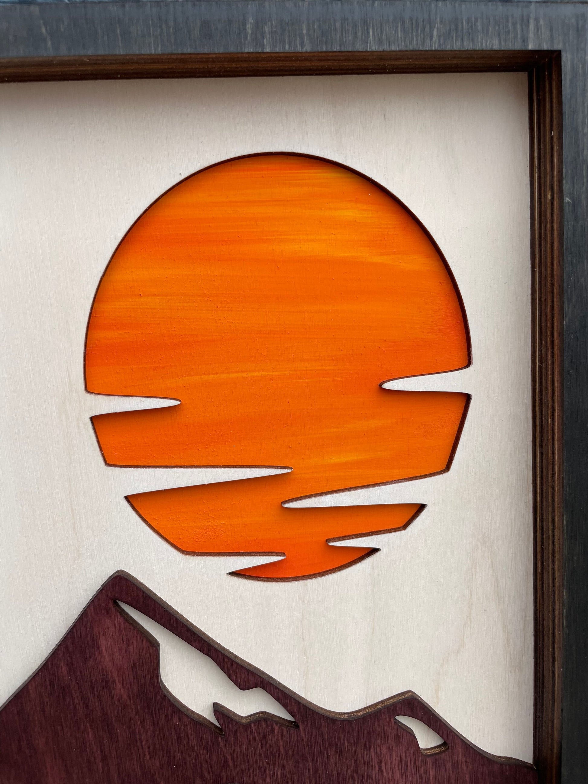 Zoomed in picture of hand painted sunset over the mountains. Wood Wall art. Colorado Mountain Range.